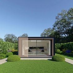 an open air living area with grass and bushes