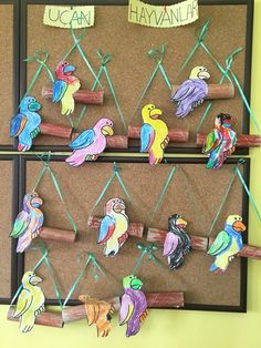 a bulletin board with colorful birds on it