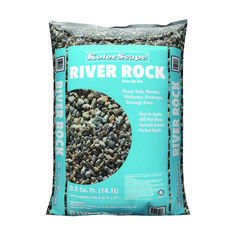 a bag of river rock sitting on top of a white surface