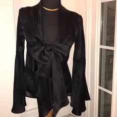 Irresistible Black Sheer Silk. Shawl Color. Low V-Neckline. One Bust-Line Button Fastening Large Bow & Hanging Ribbon Design. Long Sleeves With Dramatic Bell Design. Open Stomach Area. Incredibly Stunning Beautiful Elegant & Sexy. Euc. Made In Italy. No Snags Or Loose Seams. Immaculate Condition. A Conversation Statement. Designer Silk V-neck Blouse, Chic V-neck Party Blazer, Formal Silk V-neck Top, Sleek V-neck Blouse For Date Night, Designer Long Sleeve Blouse For Evening, Sleek V-neck Party Blouse, Designer Fitted Long Sleeve Blouse, Chic Fitted Silk Blazer, Designer Fitted Blouse For Night Out