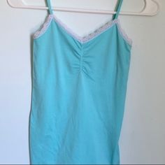 Spaghetti Strapped Light Blue Cami Size S In Excellent Condition/ Never Worn Blue Seamless Camisole For Spring, Blue Stretch Camisole With Spaghetti Straps, Blue Strapped Camisole For Summer, Summer Blue Camisole With Straps, Blue Stretch Camisole With Straps, Light Blue Camisole Tank Top For Spring, Blue Stretch Camisole With Adjustable Straps, Blue Strappy Camisole For Summer, Casual Light Blue Tank Top With Spaghetti Straps