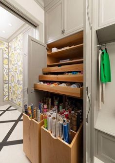 an organized pantry with drawers and shelves in the middle, filled with crafting supplies