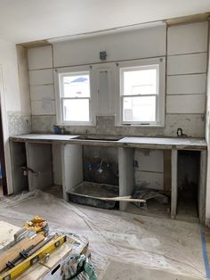 an unfinished kitchen with sink and counter tops in the process of remodeling