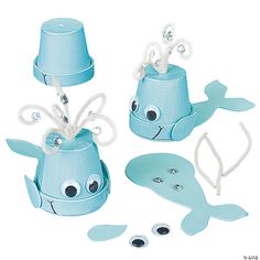 a set of three blue sea creatures with hats and pearls