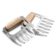 a wooden handle and two metal spatulas on a white background with clippings