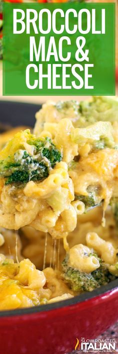 broccoli mac and cheese is being lifted from a red casserole dish