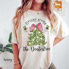 Celebrate the holidays with our Christmas Dentistry T-shirts and sweatshirts! Perfect dental hygiene gifts, these shirts are ideal for pediatric dental professionals, dental hygienists, and dental assistants (just to name a few). Great as graduation gifts or holiday presents, these dental shirts and sweatshirts are a must-have! **Note: FOR A RELAXED FIT, CHOOSE YOUR GO-TO SIZE. TO ACHIEVE AN OVERSIZED, LOOSE FIT, WE RECOMMEND GOING UP AT LEAST 1-2 SIZES. MODELS IN PHOTOS ARE WEARING 1-2 SIZES LA Dental Christmas Shirts, Dental Christmas, Christmas Dental, Dental Hygiene Gifts, Office Shirts, Dental Shirts, Pediatric Dental, Staff Gifts, Holiday Presents