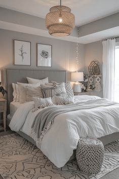 a large bed sitting in a bedroom next to two lamps on either side of the bed