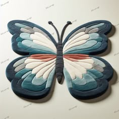 a blue butterfly with multicolored wings on it's back