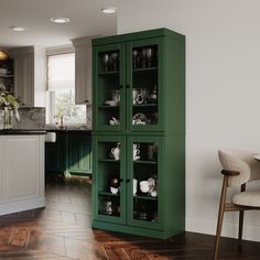 a green cabinet in the middle of a kitchen