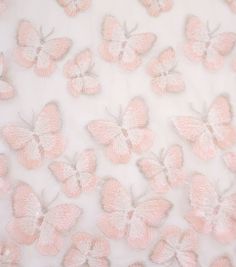 pink butterflies on white fabric with silver trims and sequins in the center