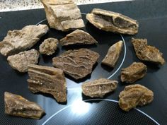 some rocks are sitting on a black table