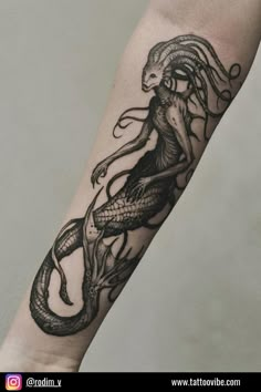 a black and white photo of a tattoo design on the arm with an octopus in it's tentacles