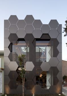 an unusual building that has been designed to look like hexagonal tiles on the outside