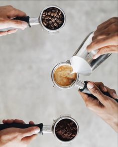 four people are holding coffee mugs with their hands