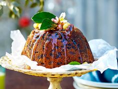 a bundt cake with icing and flowers on top