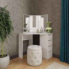 a white vanity with mirror, stool and potted plant