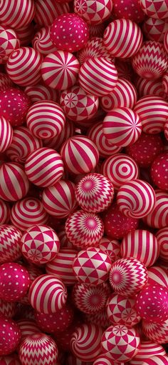 many red and white balls are stacked together