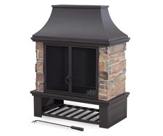 an outdoor fireplace with a chimney and grill on the front, next to it's shelf