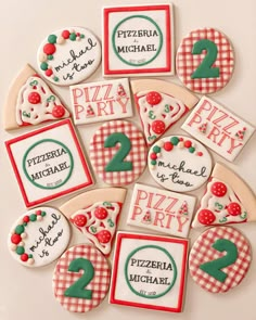 some cookies that are shaped like pizza party signs