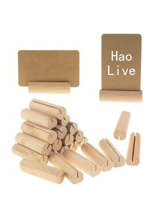 wooden pegs and clothes pins are shown in front of a sign that says hao live