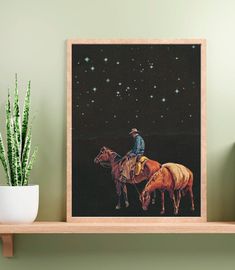 a man riding on the back of a brown horse next to a potted plant