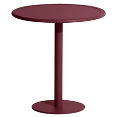 a round table with a metal base on an isolated white background for use in any room