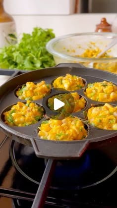 a pan filled with food sitting on top of a stove