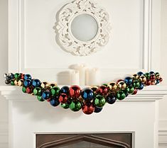 a fireplace with ornaments hanging from it's mantle