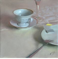 a painting of a cup and saucer with a spoon on the table next to it