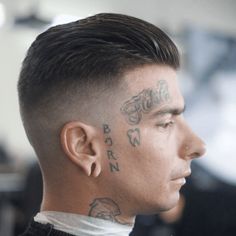 Side profile of a man with a slicked back high fade haircut, featuring tattoos on his face and neck. The hairstyle showcases neatly slicked back hair on top with a clean, high fade on the sides and back, creating a sharp and modern look. High Fade Haircut, Mens Fade, High Fade, Fade Haircuts, Slicked Back Hair, Mens Haircuts Fade, Side Profile, Inspirational Celebrities, Fade Haircut