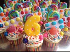 cupcakes decorated with candy and decorations for a 6th birthday or any other celebration