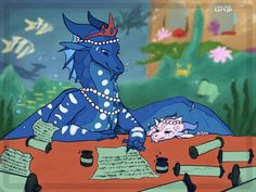 a blue dragon sitting on top of a red table next to bottles and writing utensils