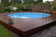 an above ground pool on a wooden deck