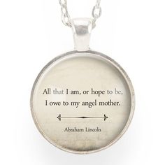 a necklace with an image of abraham lincoln on the front and quote from abraham lincoln on the back