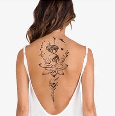 a woman with a tattoo on her back