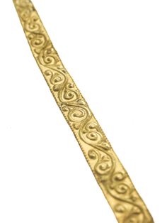 a gold bracelet with intricate designs on it