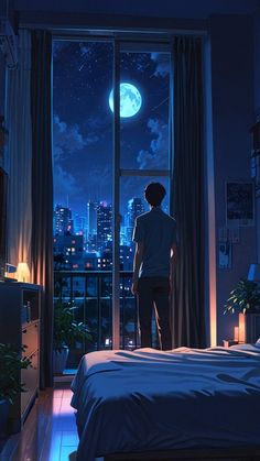 a man standing in front of a window looking out at the night sky and city