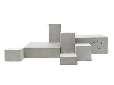 concrete blocks arranged in the shape of squares and rectangles against a white background