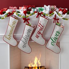 christmas stockings hanging over a fire place