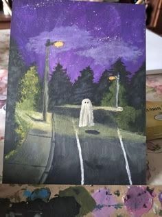 a card with a painting of a ghost on the road and trees in the background