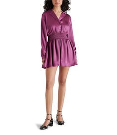 From Steve Madden&#x2C; this dress features:Satin fabricationPoint collar necklineLong sleevesSmocked waist detailFront snap closureApprox. 35" lengthPolyesterHand washImported. Purple Long Sleeve Mini Dress With Ruffles, Purple V-neck Mini Dress For Spring, Chic Purple A-line Mini Dress, Purple V-neck Mini Dress For Daywear, Purple V-neck Ruffled Mini Dress, Casual Wedding Guest Dresses, Contemporary Dresses, Daytime Dresses, Xl Dress