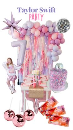 a pink and white party with balloons, cake, decorations and other items on the table