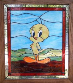 a stained glass window with a cartoon character on it