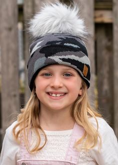 Warehouse Sale Special!  A fun camo print winter hat for your little ones! This gray kids camo print hat features a gray faux fur pom accent and warm fleece lining. Kids gray camo print knit hat Gray faux fur pom accent Crown patch on the left side One size Designed in the U.S.A. Produced in China.  *This is a kids hat* *This item is a sale item and is final sale. It will not be eligible for returns or exchanges. Flannel Sweatshirt, Kids Winter Hats, Kids Hat, Camo Designs, Grey Camo, Grey Beanie, Trendy Kids, Pom Pom Hat, Pom Beanie