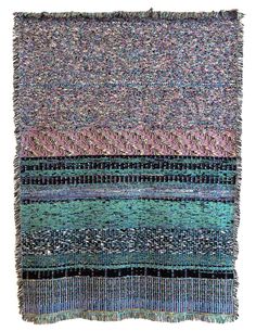 multicolored rug with fringes on the top and bottom, in different colors