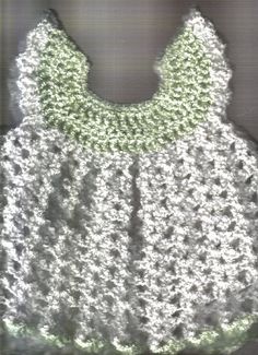 a crocheted baby dress is shown on the screen