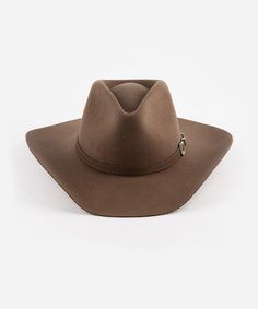 Dean was made to fill a women's western hat dreams. Featuring a pinched crown + a natural mid-length brim with an attached tonal leather band + silver buckle detailing, this classic cowboy hat was made to seamlessly be incorporated into your closet. From a first-time western hat wearer to expert, Dean fits the mold as a timeless style cowgirl hat with a touch of modern refinement, made for the city to the countryside. Men Hats Styles, Womens Western Hats, Classic Cowboy, Western Hat, Travel Hat, Cowgirl Hat, Timeless Classic Style, Western Hats, Cowgirl Hats