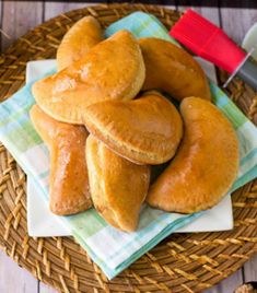 a basket filled with donuts sitting on top of a table