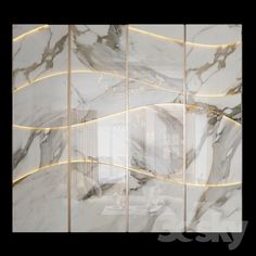 an abstract marble wall with gold lines on the sides and lights in the middle that are lit up